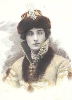 an old photo of a woman wearing a fur hat and dress with jewels on her head