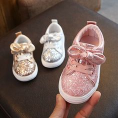 Not all that glitters are expensive! And so are these Glittered Bowknot Sneakers that shine and make those little feet walk with comfort and style. Give your baby the best first walker fashion sneakers to match a good-looking outfit for that adorable overall look! Features: Paillette fashion element Flexible rubber sole Soft and comfortable footwear for babies Adjustable lace closure type Accent bow and glittered texture finish Size Chart (Inches): To get insole length, please measure your child Girls Glitter Shoes, Bling Baby Shoes, Bowknot Shoes, Baby Shoes Diy, Bowknot Dress, Girls Shoes Sneakers, Shoes Diy