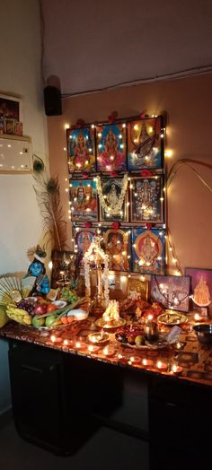 a table topped with lots of different types of food and candles on top of it