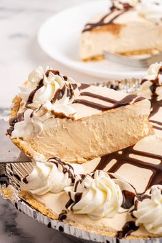 no bake peanut butter pie with chocolate drizzle and whipped cream on top