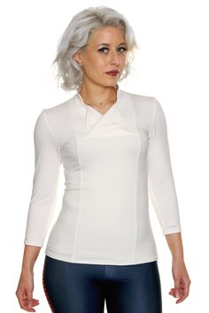 Product Details Adventure amongst the stars in style with our Space Rebel Top! Inspired by some of our favorite space adventuring heroes, rebels, and smugglers, the Space Rebel Top features a mandarin-style collar, double-breasted flap neckline, and 3/4 sleeves. Please Note: Because this is a fitted top in a white fabric, it is prone to being somewhat see-through. We recommend pairing it with a white colored undergarment if you desire. Victoria wore a thin white camisole underneath her top with Galaxy Clothing, Cassian Andor, Galaxy Outfit, Geeky Clothes, White Camisole, Jyn Erso, White Tunic Tops, Return Of The Jedi, Empire Strikes Back