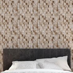 a bed sitting in front of a wall covered in blocks of wood and white linens