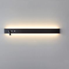 a wall mounted light that is on the side of a wall