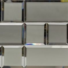 a close up view of a glass tile wall