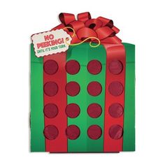 a green and red gift box with polka dots