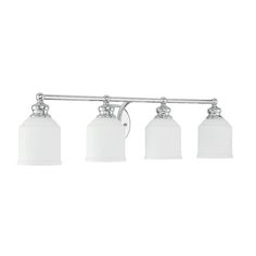 three light bathroom fixture with white glass shades on the sides and chrome finish, in an old