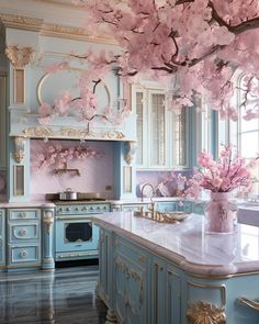 a kitchen with blue cabinets and pink flowers