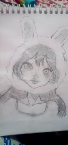 a pencil drawing of a girl with bunny ears on her head and an animal ear