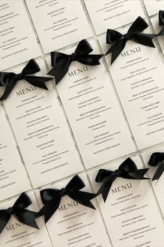 Wedding menu card printed on textured white card featuring a black satin bow detail Iron Gate Color Ideas Entrance, Classy Black White Wedding, Prada Themed Birthday Party, Wedding Menu Table Setting, Black Tie Wedding Theme Classy, Black Tie Themed Wedding, Black White Modern Wedding, Black And White Menu Design, Gate Color Ideas Entrance