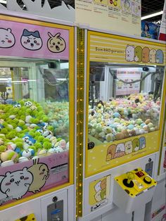 the vending machine is filled with many different kinds of candy and stuffed animals on display