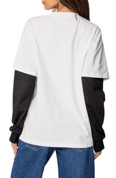 Show them you made it in this empowering top designed in a layered look with contrasting sleeves. Crewneck Long sleeves 100% cotton Machine wash, dry flat Imported Relaxed Fit Cotton Tops With Contrast Color, Cotton Tops With Contrast Sleeves For Streetwear, Cotton Top With Contrast Sleeves For Streetwear, Cotton Tops With Contrast Color And Relaxed Fit, Casual Oversized Top With Contrast Color, Long Sleeve Cotton Tops With Contrast Color, Cotton Long Sleeve Tops With Contrast Color, Long Sleeve Tops With Contrast Sleeves For Spring, Oversized Striped Sleeve Tops For Fall