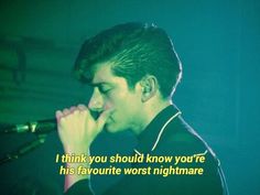 a young man singing into a microphone with a quote on the screen behind him that reads, i think you should know how you know if he has his favorite worst nightmares