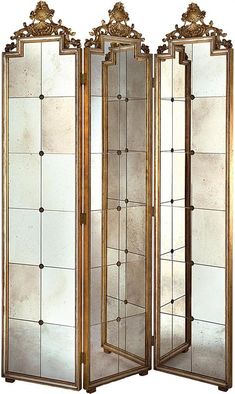 an ornately decorated room divider with four panels