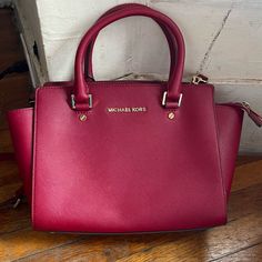 Used And Still Like Brand New. Minor Flaws (Minor Stains Inside Bag, Few Marks On Bags, Color On Feet Have Faded , No Tears). Marks Can Be Easily Removed With Leather Cleaner/Stain Remover. True Color Of Bag Is The First Picture. Michael Kors Burgundy Shopping Bags, Michael Kors Burgundy Bag, Michael Kors Burgundy Bags With Branded Hardware, Leather Cleaner, Crossbody Satchel, Bags Michael Kors, Inside Bag, Michael Kors Crossbody, Satchel Bag