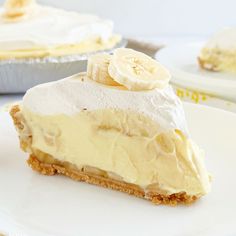 a piece of banana cream pie sitting on top of a white plate next to another pie