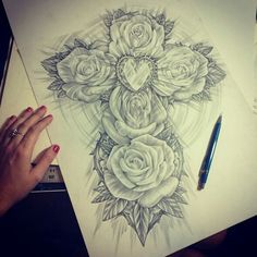 a drawing of roses on paper with a pen