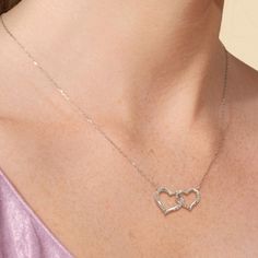 Two twisted hearts intertwined - together, forever. This heart pendant in white gold features a big and small heart cut-out linked together as a symbol of everlasting love. Diamonds adorn the pair of hearts. This necklace can represent the special bond between sisters, mother and child, or couples. Hearts Intertwined, Twisted Heart, Heart Cut Out, Floral Pendant, Everlasting Love, Fancy Color Diamonds, Together Forever, Big And Small, Small Heart