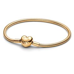 Make your story shine with the Pandora Moments Heart Clasp Snake Chain Bracelet. Our iconic snake chain bracelet gets a gleaming update in 14k gold plating, with a polished heart-shaped clasp. The clasp includes an engraved Pandora logo on one side and the Pandora Crown O logo on the other. Style this Pandora snake chain bracelet with up to 16 to 18 charms for an iconic everyday look that is all yours. Pandora Style #: 563050C00-19 Pandora Gold Bracelet, Gold Pandora Bracelet, Gold Pandora, Pandora Logo, Expensive Things, Pandora Gold, Wedding Day Jewelry, Snake Chain Bracelets, Pandora Bracelet Charms