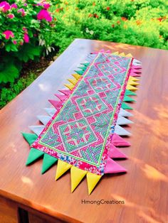 Beautiful table runner perfect for any occasions. Dress it up or down. This is a one of a kind  using hmong fabric.  33x14 inches Colors may be slightly different when you receive it in person. I ship USPS 1 to 2 days after purchase. I do not ship on Saturdays. Are you in first class mail which takes 3 to 5 days for you to receive it. Please let me know if you have any questions.  Thanks for looking.￼ ------------------------------------------------- NO RETURNS, REFUNDS, OR EXCHANGES **Please message me if there are any issues with your item. Hmong Paj Ntaub, Hmong Clothes, Beautiful Table, Cross Stitch, Let It Be, Christmas Ornaments, Fabric, Color