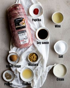 ingredients to make an italian meatloaf recipe laid out on a white towel, including sauces and condiments