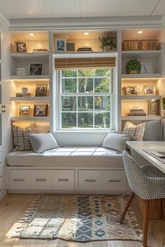 a white window seat sitting under a window next to a desk