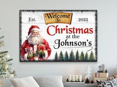 a living room with a christmas sign on the wall