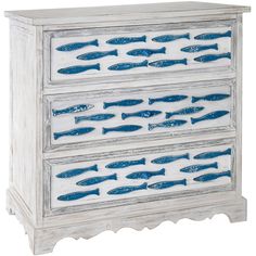 a white dresser with blue fish painted on it