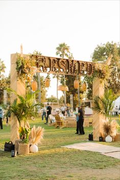 an outdoor event with palm trees and decorations