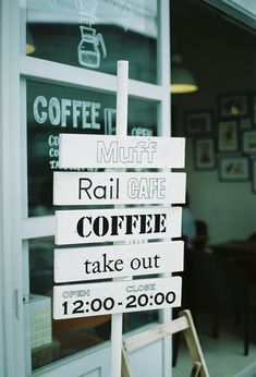 a sign in front of a coffee shop that says rail cafe, take out, 12 30 - 20 00