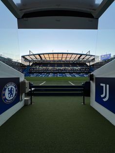 an empty soccer stadium with blue seats