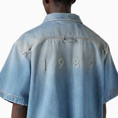 Short sleeved shirt by 1989 Studio in blue cotton denim featuring a boxy fit, patch pockets at chest, front button fastening and logo at back.Model wears size XL Model measurements: Height: 188 cm Chest: 91 cm Waist: 73 cm Hips: 95 cm100% Cotton Short Sleeve Denim Shirt, Tee Shirt Fashion, Denim Pocket, Suit Accessories, Laid Back Style, Mens Fashion Trends, T-shirt Polos, Shirt Sale, Denim Shirt