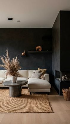 a living room with two couches and a coffee table in front of a fireplace