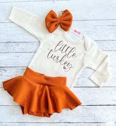 "Thanksgiving Outfit Girl, Little Turkey Fall Outfit, Baby Girl First Thanksgiving Outfit, Niece Aunt Gift You may choose: ~\"Little Turkey\" bodysuit as shown. Available in short or long sleeve. ~Adorable skirted bummie/bloomer created in the perfect fall color. ~Matching fabric bow/headband All items are handmade in our studio with loving care. Copyright © 2008 by ChristiCreations®, LLC. All rights reserved. This design or any portion thereof may not be reproduced or used in any manner whatsoe Infant Thanksgiving Outfit, Thanksgiving First Birthday Girl, Thanksgiving Onesie Girl, Fall Newborn Outfits, First Thanksgiving Outfit Girl, Newborn Thanksgiving Outfit, Baby First Thanksgiving, Fall Baby Outfits