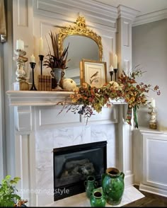 a living room filled with furniture and a fire place under a mirror on top of a mantle