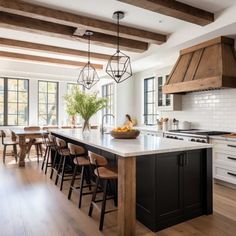 a large kitchen with an island in the middle