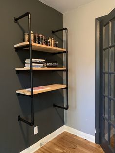 the shelves in this room are empty and have books on them, but no one is present