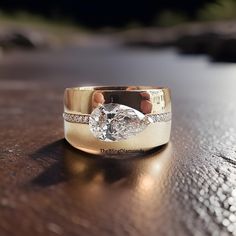 a close up of a wedding ring on a table