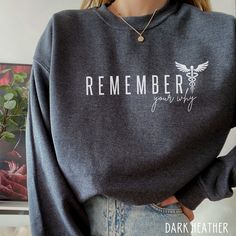 This Inspirational Nurse / Medical Sweatshirt is perfect for anyone in medicine. Great Gift idea for your favorite Nurse, Nurse Preceptor, or nursing school student! ♥ W E L C O M E  T O  S K E T C H Y  C A T  D E S I G N S ! ♥ Click here to return to our shop's home page ⇒ https://www.etsy.com/shop/SketchyCatDesigns Say hello to your new favorite sweatshirt! All of our products are printed with eco-friendly water-based inks, giving them the softest feel. The design itself is embedded into the fabric so that your shirt is cozy and comfy and has an already washed look. They look amazing sized up as well. We love that lived-in look! P R O D U C T  *  Unisex Sizing - Relaxed Fit  *  50/50 cotton + polyester  *  Medium thickness  *  Please refer size chart for measurements  *  We are unable to Nursing School Crewneck, Nurse T Shirts Design, Preceptor Gift Ideas Nurses, Nurse Sweatshirt Ideas, Cute Nurse Outfits, Nurse Preceptor, Nursing School Student, Nursing Instructor, Nursing Student Shirts