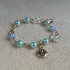 - One Of A Kind Beaded Charm Bracelet - Featuring Light Blue Pearl Beads, Clear White Butterfly Beads, A Gold Metal Crescent Moon Charm, A Star Charm That Says “Just For You,” And Gold Metal Links - Gold Colored Hardware - Clasps Closed. No Stretch. - Size/ Circumference Is 6.5” (See Picture) - Handmade (By Myself). Perfect To Treat Yourself Or To Give As A Gift! **Add 2 Jewelry Items Marked “2 For $20” To Your Bundle And I Will Send You An Offer For $20** Check Out The “Boutique” Tab In My Clos