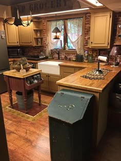 a kitchen with wooden floors and an island