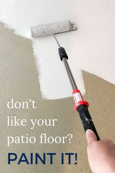 a person is painting the ceiling with white paint and a red tool that says, don't like your patio floor? paint it