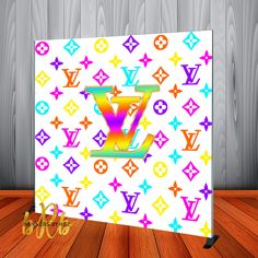 the colorful louis vuitton pattern is on display in front of a wooden wall