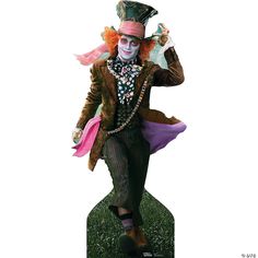 a statue of a man dressed as the mad hatter is shown in front of a white background