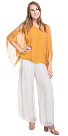 Solid Color Cold-Shoulder Blouse with Balloon Hem and Draped Sleeves. 30% Silk 70% Viscose Fits sizes XS- XL Made in Italy Spring Blouse With Sheer Flowy Sleeves, Spring Blouse With Sheer Sleeves And Flowy Fit, Spring Silk Off-shoulder Blouse, Off-shoulder Silk Blouse For Spring, Spring Blouse With Set-in Sleeves, Flowy Summer Tops With Sheer Sleeves, Flowy Tops With Sheer Sleeves For Summer, Spring Stretch Viscose Blouse, Summer V-neck Blouse With Sheer Sleeves