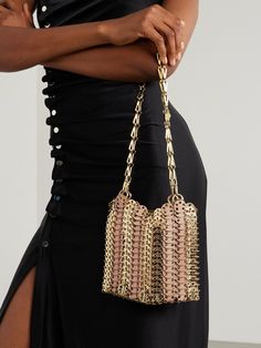 Named after the year of its release, Rabanne's '1969' bag remains iconic to this very day. This version is constructed from leather and gold-tone chainmail and has two detachable chain straps. Stow your evening-out essentials inside, like your cards, keys and lipstick. Evening Shoulder Bag With Metal Chain Strap, Luxury Metal Bag With Chain Strap, Luxury Metal Bags With Chain Strap, Evening Metal Chain Shoulder Bag, Formal Metal Shoulder Bag With Chain Strap, Gold Chain Link Shoulder Bag For Formal Occasions, Gold Chain Link Evening Shoulder Bag, Gold Chain Link Shoulder Bag For Party, Gold Chain Link Shoulder Bag