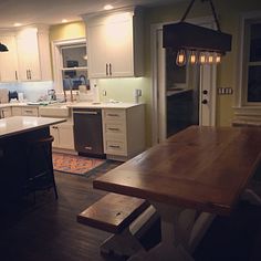 a large kitchen with an island in the middle