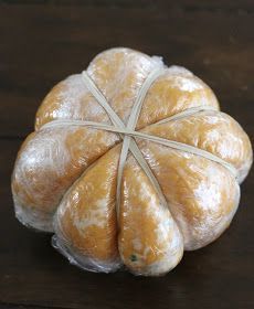 an unwrapped pastry sitting on top of a wooden table