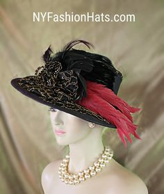 Haute Couture Black And Metallic Gold Embroidered Designer Hat For Women. This One Of A Kind Statement Dress Hat Is Embellished With A Black Bow Enhanced With A Handmade Black And Metallic Gold Embroidered Bow. Expensive Black Hackle Rooster Feathers Are Placed Within This Exquisite Bowing Topped Off With Pink Long Coque Feathers. The Feather Colors Are Between A Red And A Pink. A Black Hat Band Encircles The Crown Of This High Fashion Hat. Black Rhinestone Trim Is Placed Withing The Bowing. One Of A Kind Hat - Custom Made New Condition. Measurements: 22.5" Crown Size. Brim Is Small To Medium Sized. This Is Not A Wide Brim Hat. This Hat Is Suited For Winter Spring Summer And Fall. This Fashion Hat Is Custom Made By WomensDesignerHats.com A Division Of NYFashionHats Haute Couture Headwear. Fitted Brimmed Costume Hat For Evening, Fitted Black Hat For Wedding, Fitted Top Hat With Curved Brim For Evening, Fitted Top Hat With Flat Brim For Evening, Victorian Fitted Brimmed Costume Hats, Victorian Evening Hats For Kentucky Derby, Formal Fitted Cloche Costume Hat, Fitted Gatsby Mini Hats For Vintage Events, Fitted Gatsby Mini Hats For Church