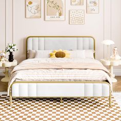 a white bed sitting in a bedroom on top of a checkered floor next to a wall