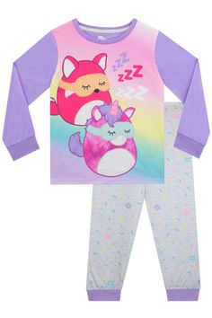 Squishmallow collectors will be able to match their favourite collectables with these Squishmallows pyjamas. Featuing two of the cuddly critters, the top has Fifi the Fox and Lola the Tie-Dye Unicorn snoozing in sleep masks on a rainbow background and ZZZ lettering. The grey bottoms complete the set with a sweet sprinkles design. Purple sleeves and cuffed bottoms will keep them cosy as they dream of the Squishmallow Squad! Machine washable. 100% Polyester. Paw Patrol Pajamas, Sprinkles Design, Logo Purple, Sleep Masks, Short Pj Set, Rainbow Background, Kid Character, Girls Characters, Girls Pajamas